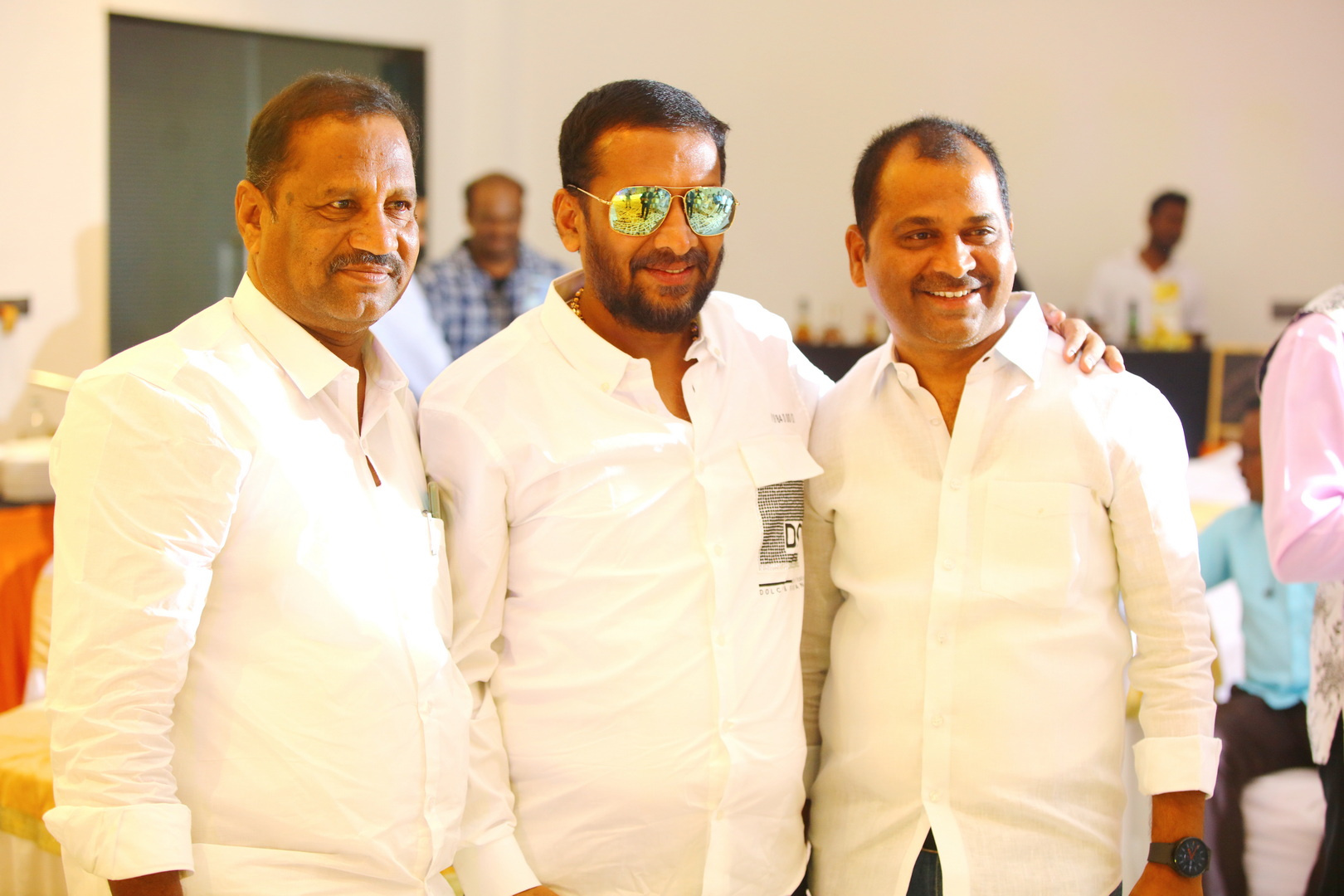 Guests posing for a group photo at the anniversary function