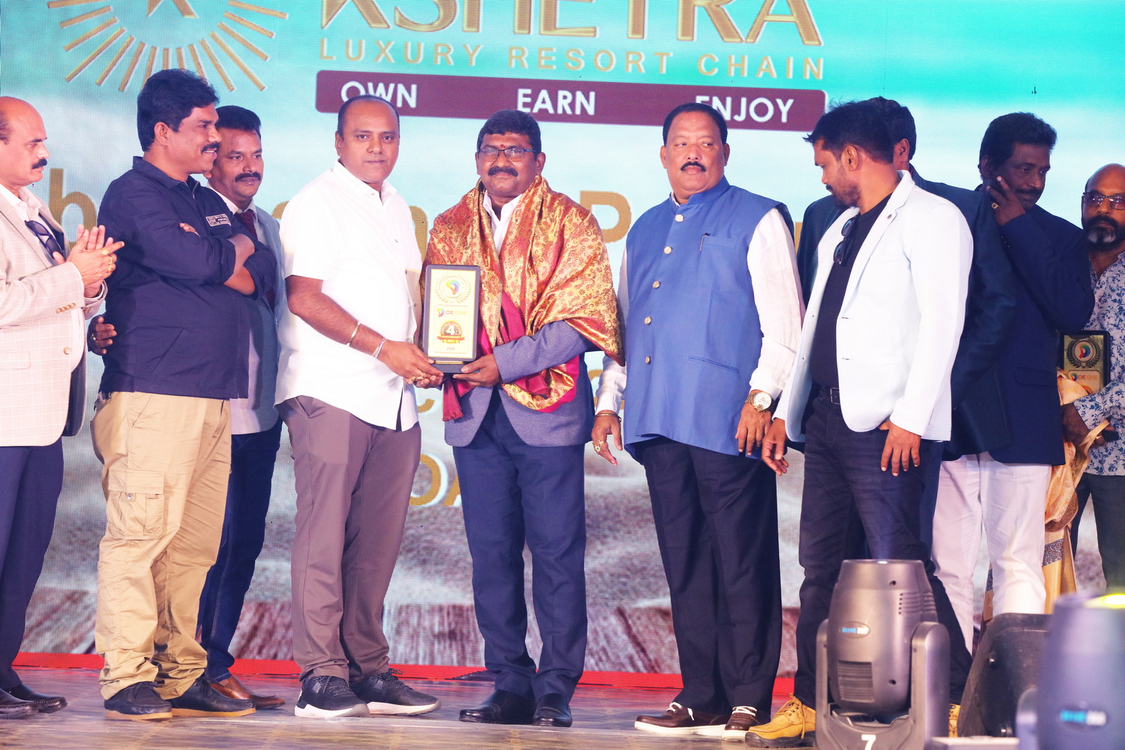 Guests posing for a group photo at the anniversary function